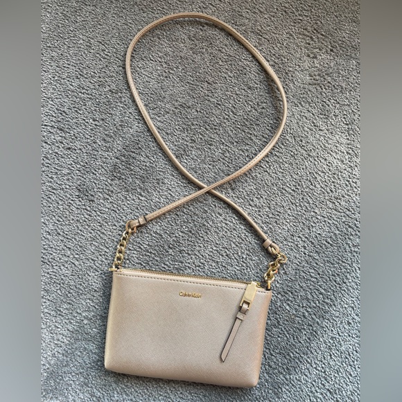 Calvin Klein Handbags - NWOT CALVIN KLEIN Cross Body bag. Shimmery Gold Beige color.